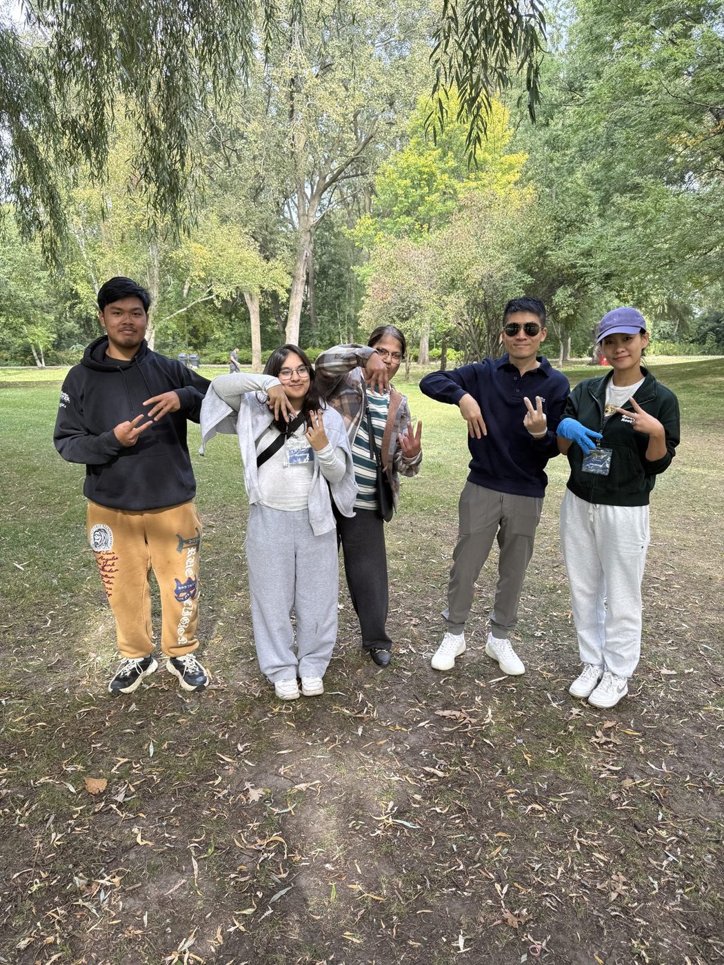 A group of MiVolunteer volunteers together at a park cleanup in the GTHA